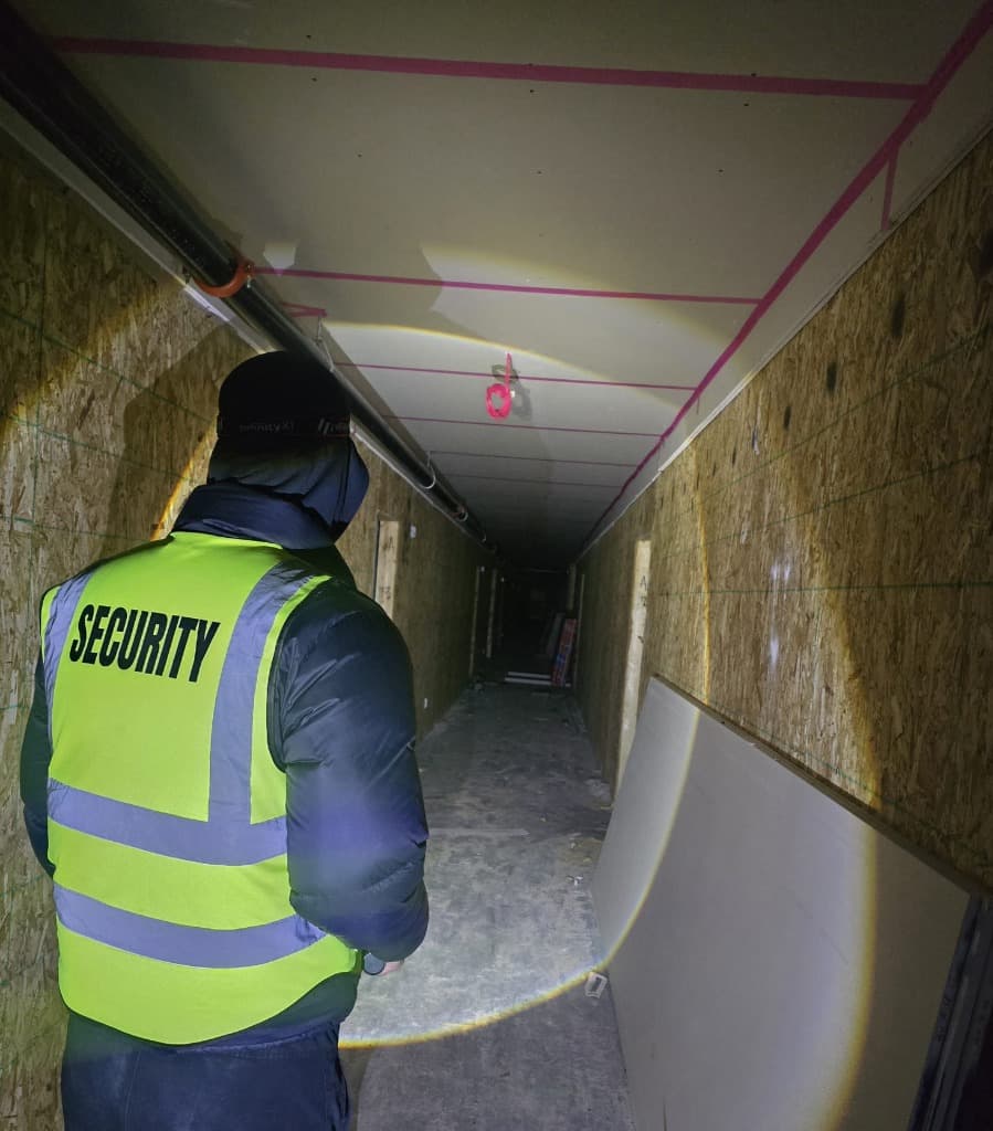 Zed Plus security guard inspecting a construction site